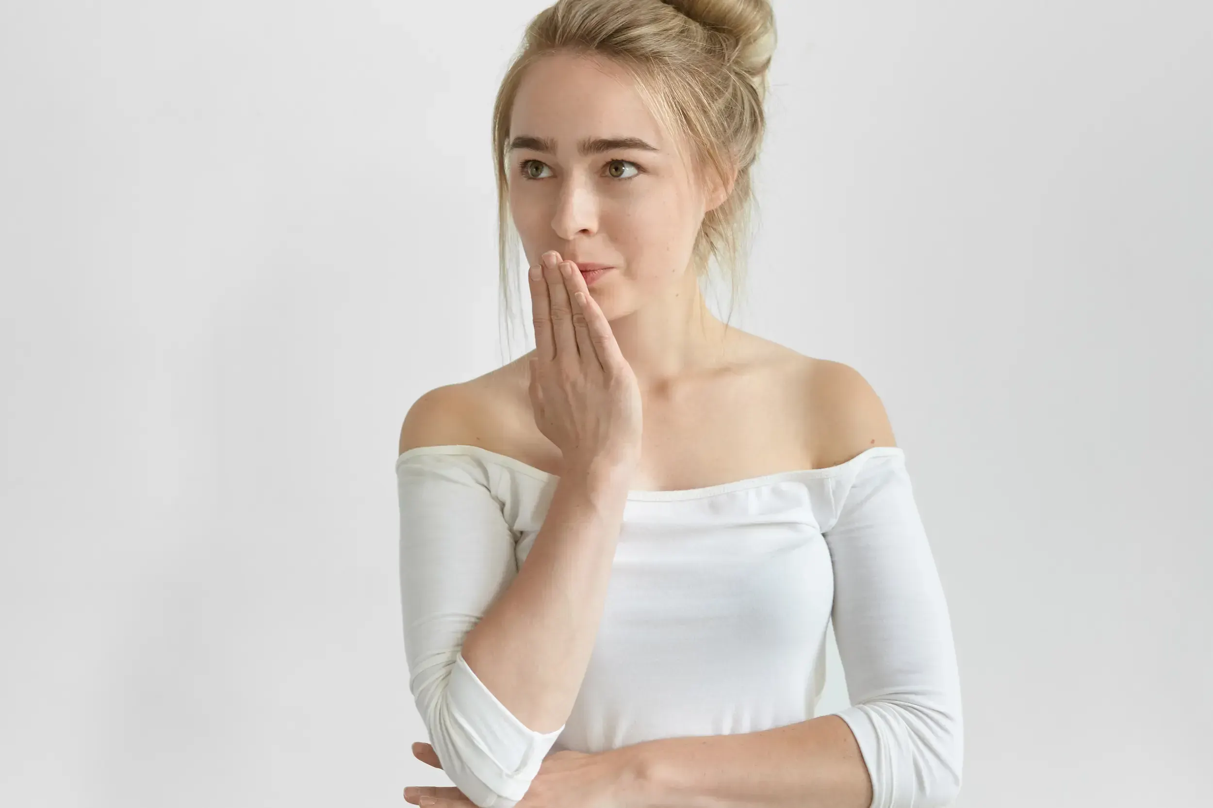 Patient holding jaw experiencing TMJ pain at East Ellijay Family and Cosmetic Dentistry